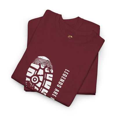 Unisex heavy cotton tee with "Legends are made NOT BORN" graphic, folded and maroon color.