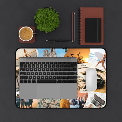 Vision Board Desk Mat with motivational collage design under laptop and mouse, workspace with coffee, plant, notebooks, and pens on dark surface