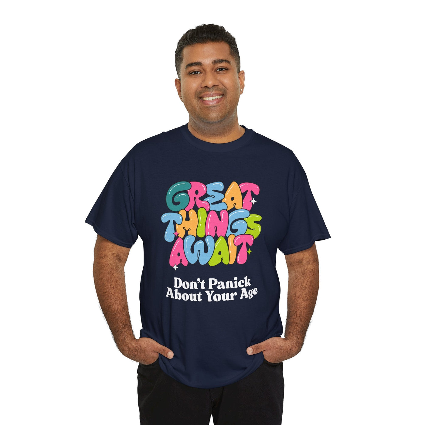 Positive vibes t-shirt with "Great Things Await, Don't Panic About Your Age" message in colorful, bubbly font. Perfect for encouragement and anti-aging humor.