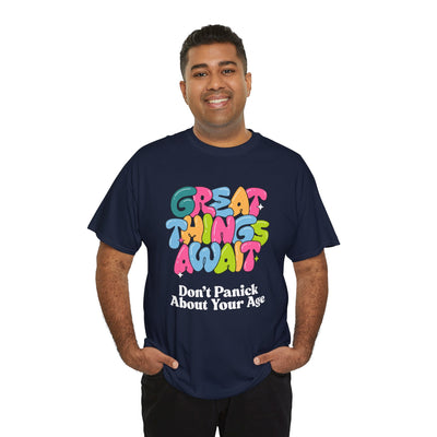 Positive vibes t-shirt with "Great Things Await, Don't Panic About Your Age" message in colorful, bubbly font. Perfect for encouragement and anti-aging humor.
