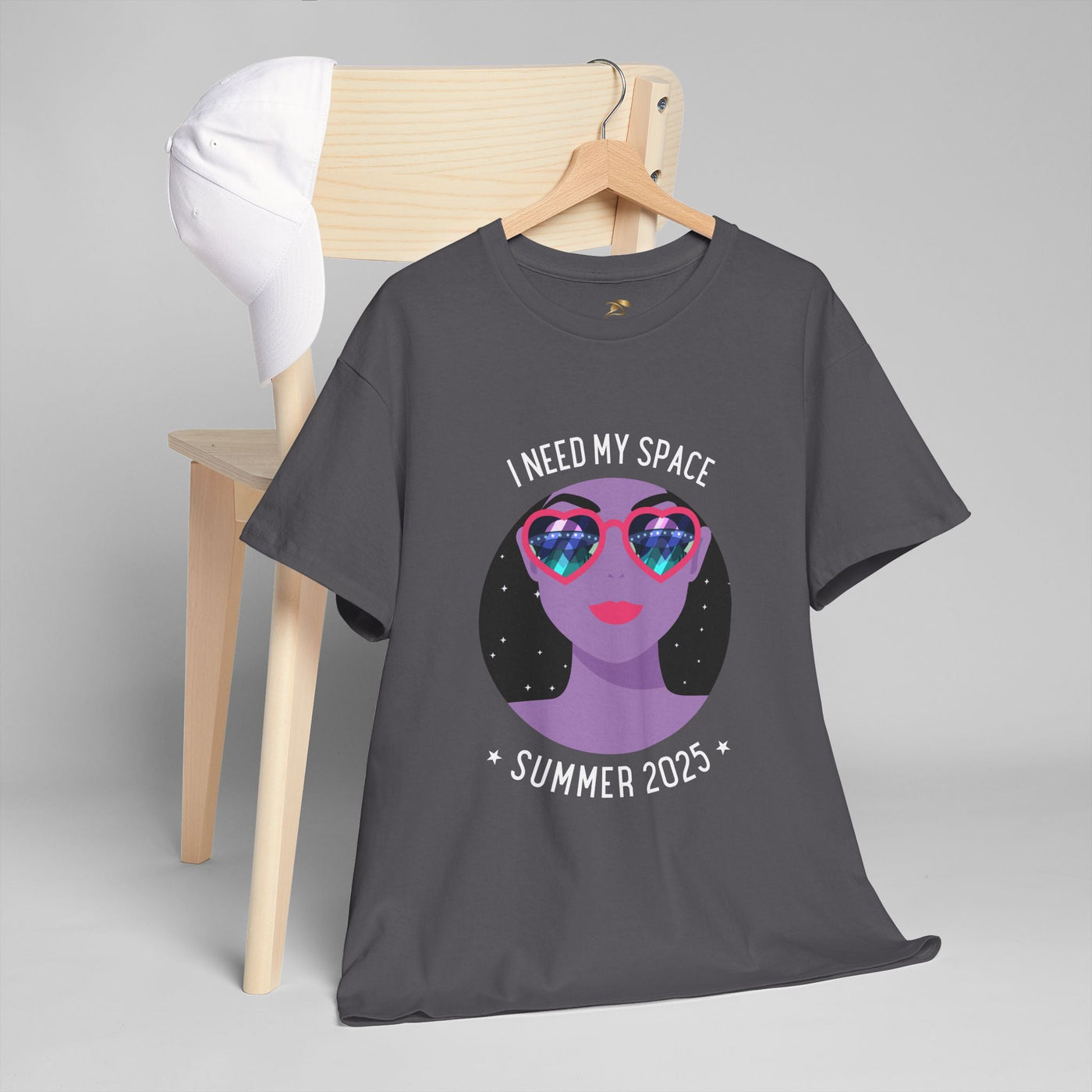Astronaut Space Vibes Tee with galaxy graphic, cosmic relaxation shirt on hanger with white cap.