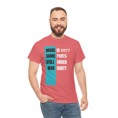 Humorous aging t-shirt with "Made In Some Parts Still Under Warranty" slogan, perfect as a funny birthday gift.