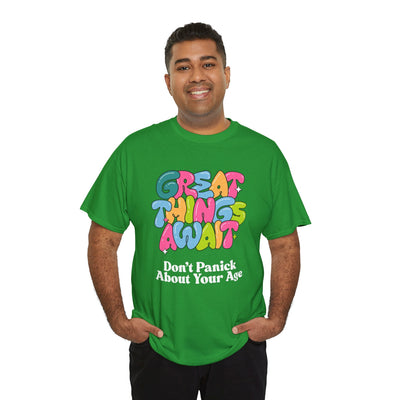 Positive vibes "Great Things Await" t-shirt featuring anti-aging humor in colorful design.