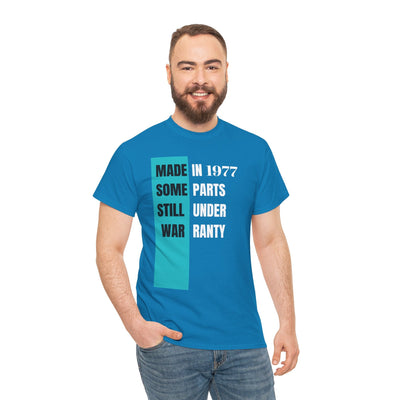 Humorous "Made In Some Parts Still Under Warranty" t-shirt, funny aging and birthday gift, vintage style, unisex, blue.