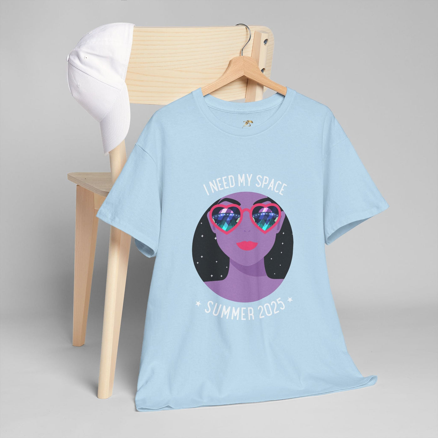 Astronaut space vibes tee with galaxy graphic, light blue shirt on hanger, space lover gift.