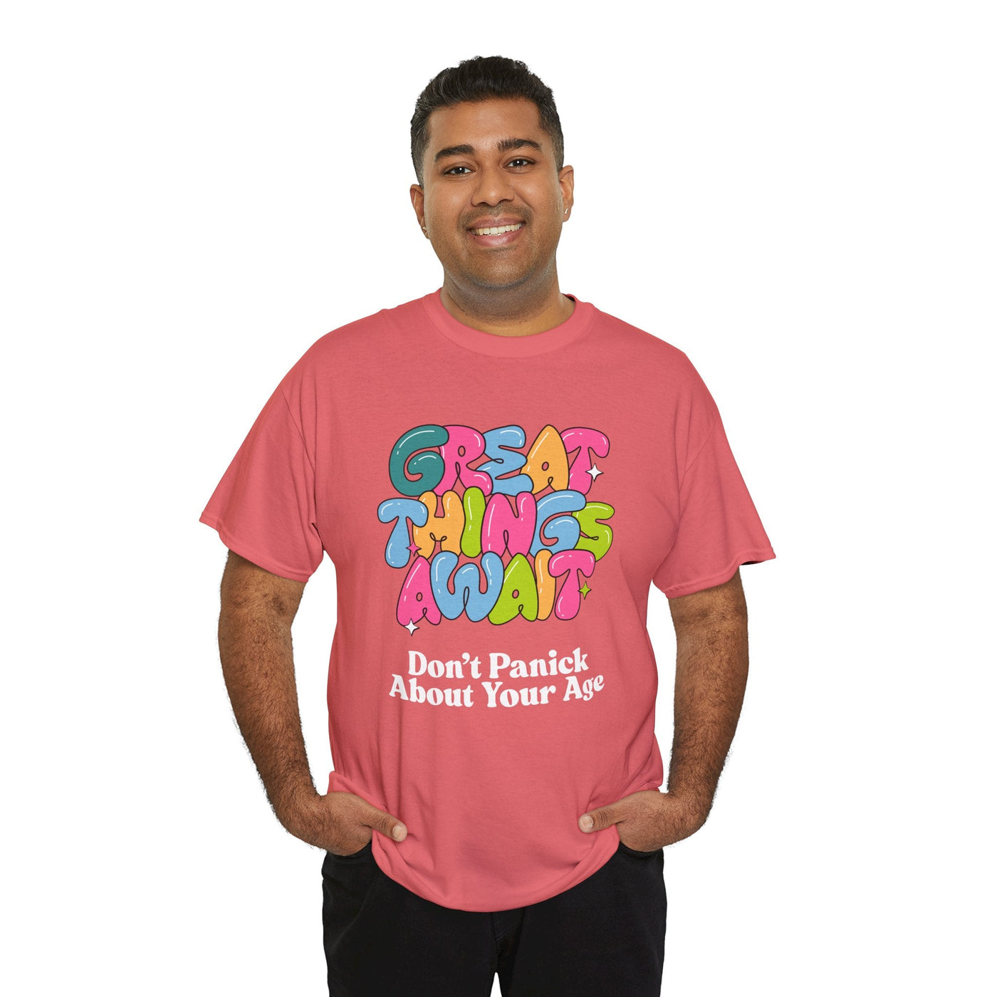 Positive vibes t-shirt with "Great Things Await" message in colorful bubbly font, promoting optimism about aging.