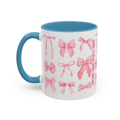 Personalized Mother's Day coffee mug with pink coquette bow design, blue handle, and interior.