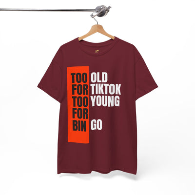 Red t-shirt with bold black, white, and orange text reading "Too Old For TikTok, Too Young For Bingo," humorous design for Gen X and Millennials.