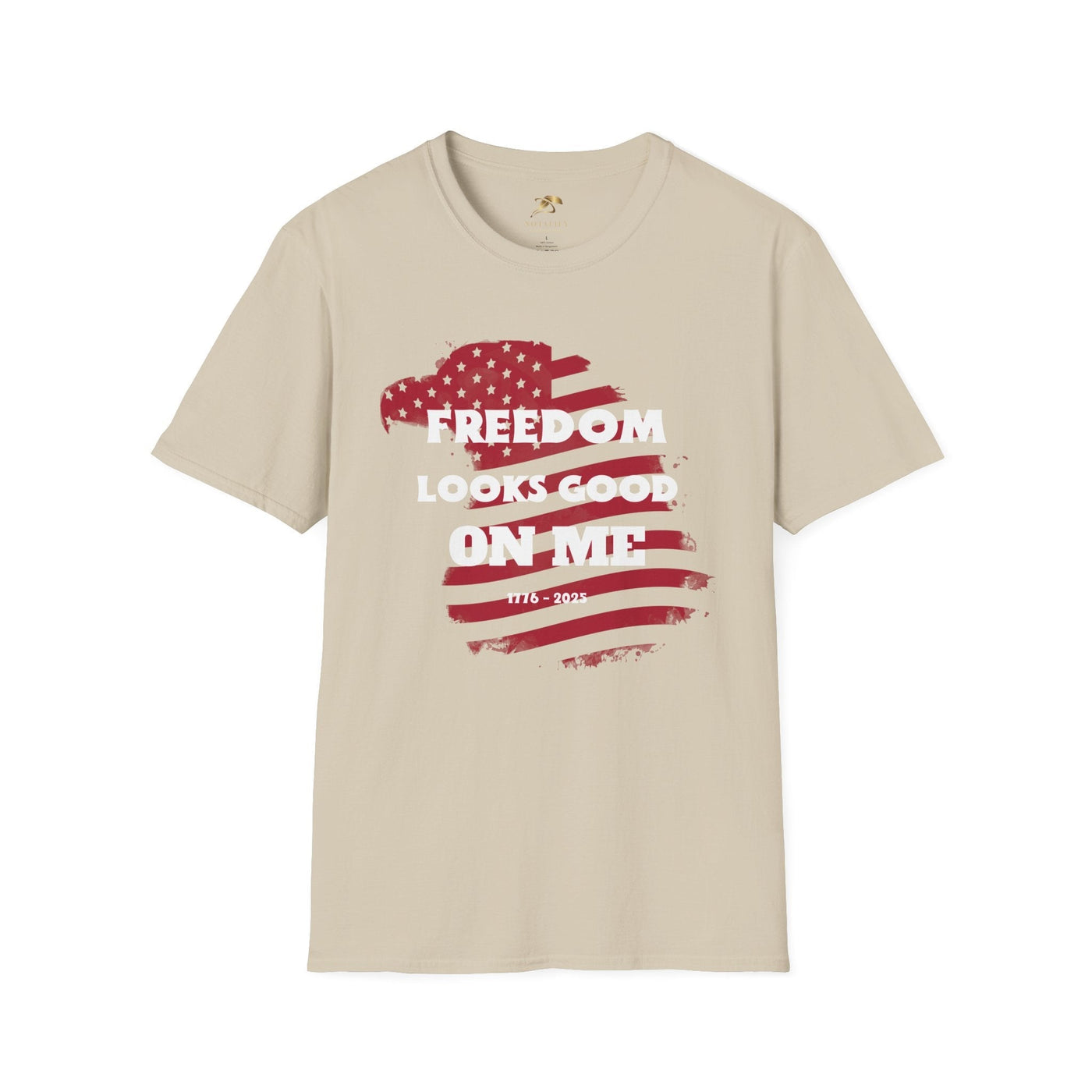 Unisex beige tee with "Freedom Looks Good On Me" text and American flag design, ideal for 4th of July celebrations and patriotic gatherings.