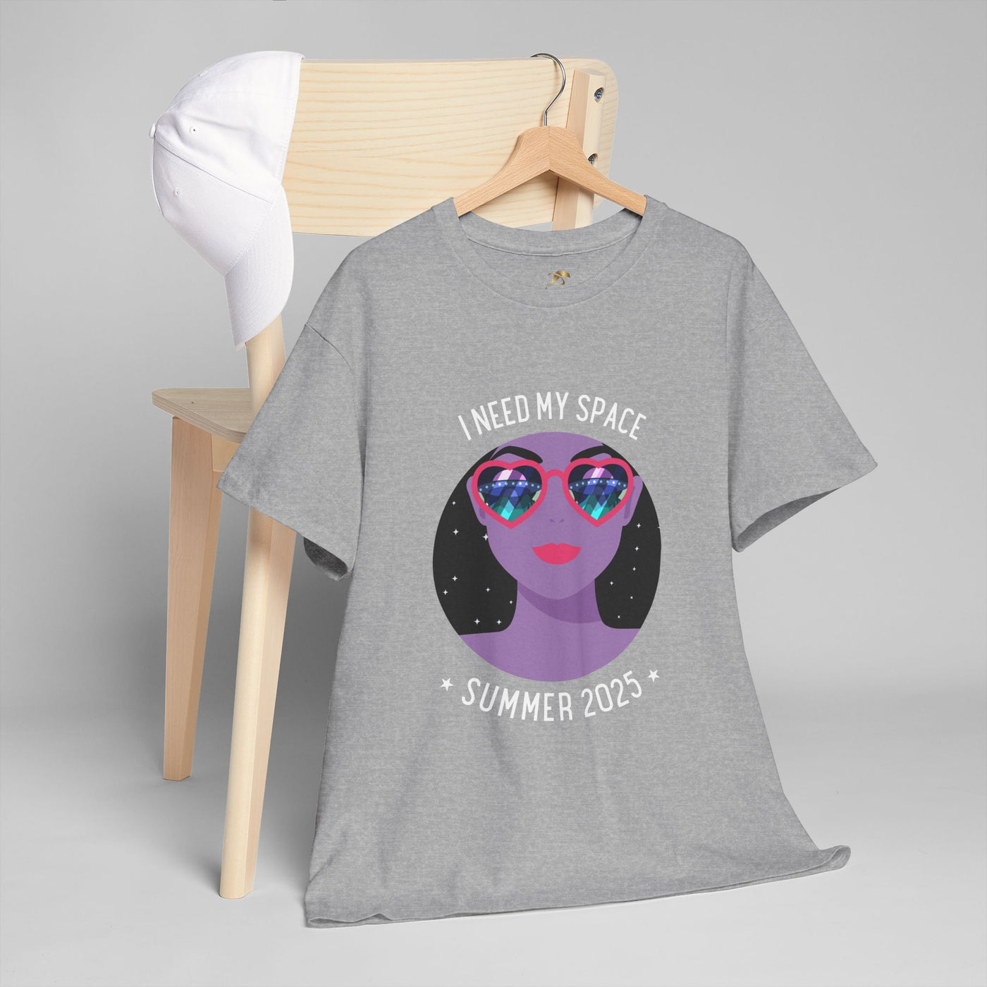 Astronaut Space Vibes Tee with galaxy graphic, gray shirt on hanger, cosmic relaxation theme.
