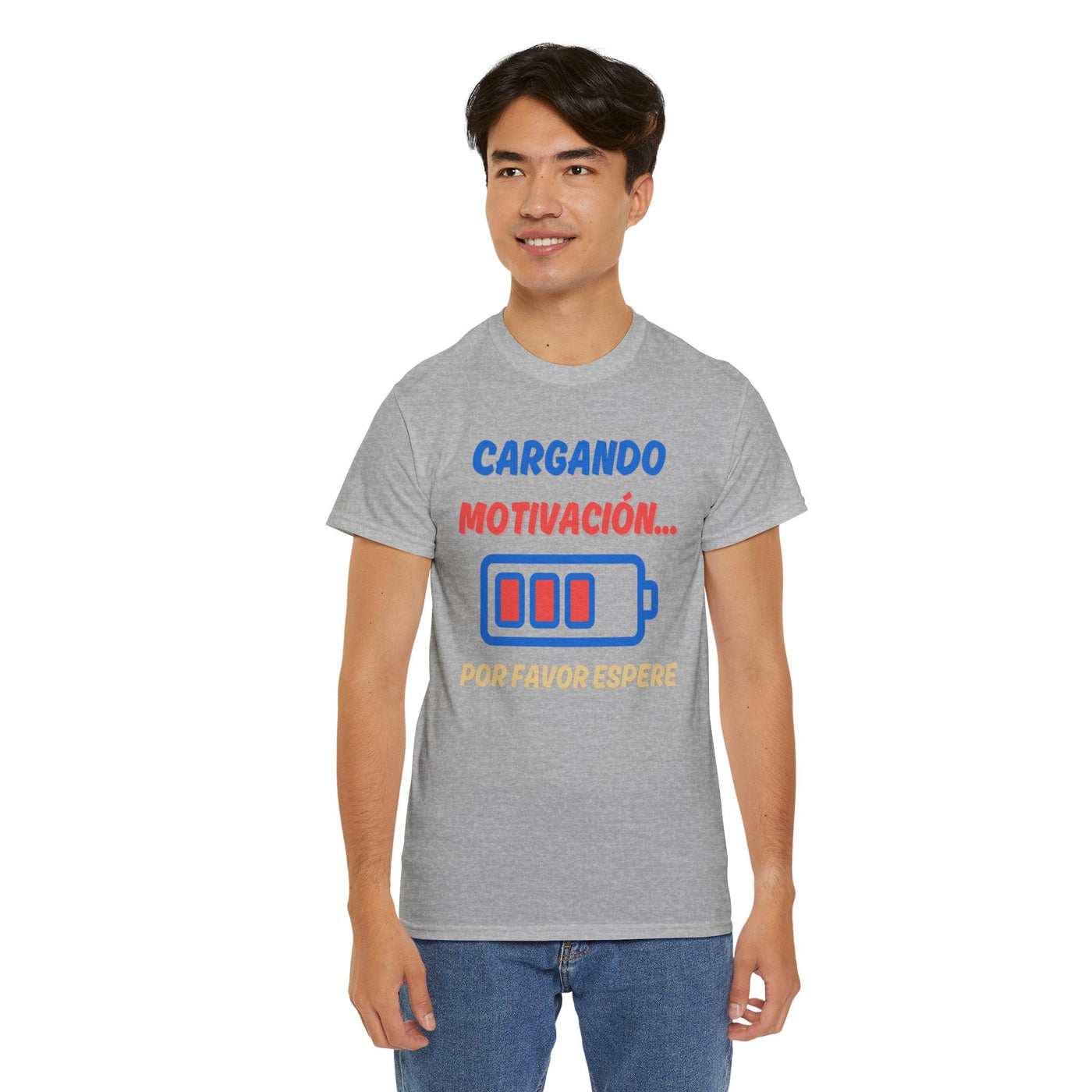 Unisex heavy cotton tee with "cargando motivación" and battery graphic, humorous Spanish phrase, motivational design.