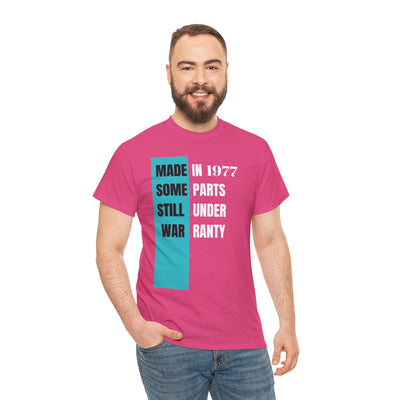Humorous vintage style t-shirt with "Made In Some Parts Still Under Warranty" slogan, ideal birthday gift.