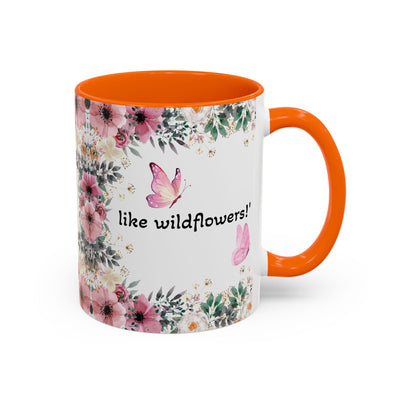Inspirational quote mug with wildflower design and orange interior.