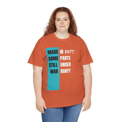 Humorous "Made In Some Parts Still Under Warranty" T-shirt in vintage style, perfect funny birthday gift.