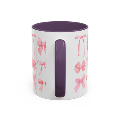 Personalized Mother's Day coffee mug with coquette bow design, purple interior and handle.