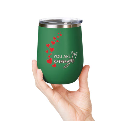 12oz Positive Affirmation Wine Tumbler with "You're enough" design held in hand; stainless steel, insulated.