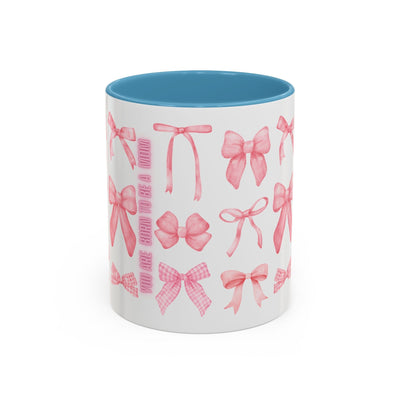 Personalized Mother's Day mug with pink bow design and blue interior.