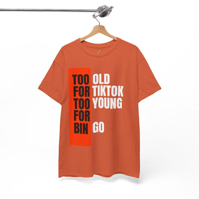 Funny "Too Old For TikTok, Too Young For Bingo" T-shirt for Gen X and Millennials, unisex design, bold text in black, white, and orange on an orange tee, ideal for casual wear and gifting.