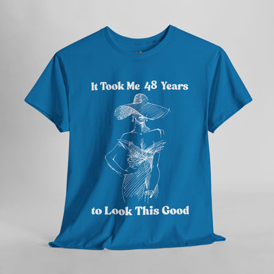 Chic blue t-shirt with "It Took Me 48 Years to Look This Good" slogan and elegant woman illustration.