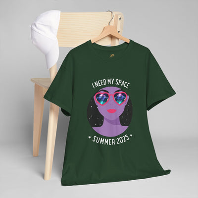 Astronaut Space Vibes Tee with galaxy graphic on hanger next to chair and hat. Perfect cosmic relaxation shirt for space lovers.