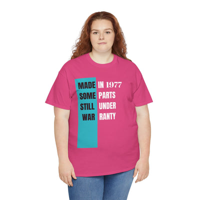 Funny aging t-shirt with "Made In Some Parts Still Under Warranty" slogan, vintage style, unisex.